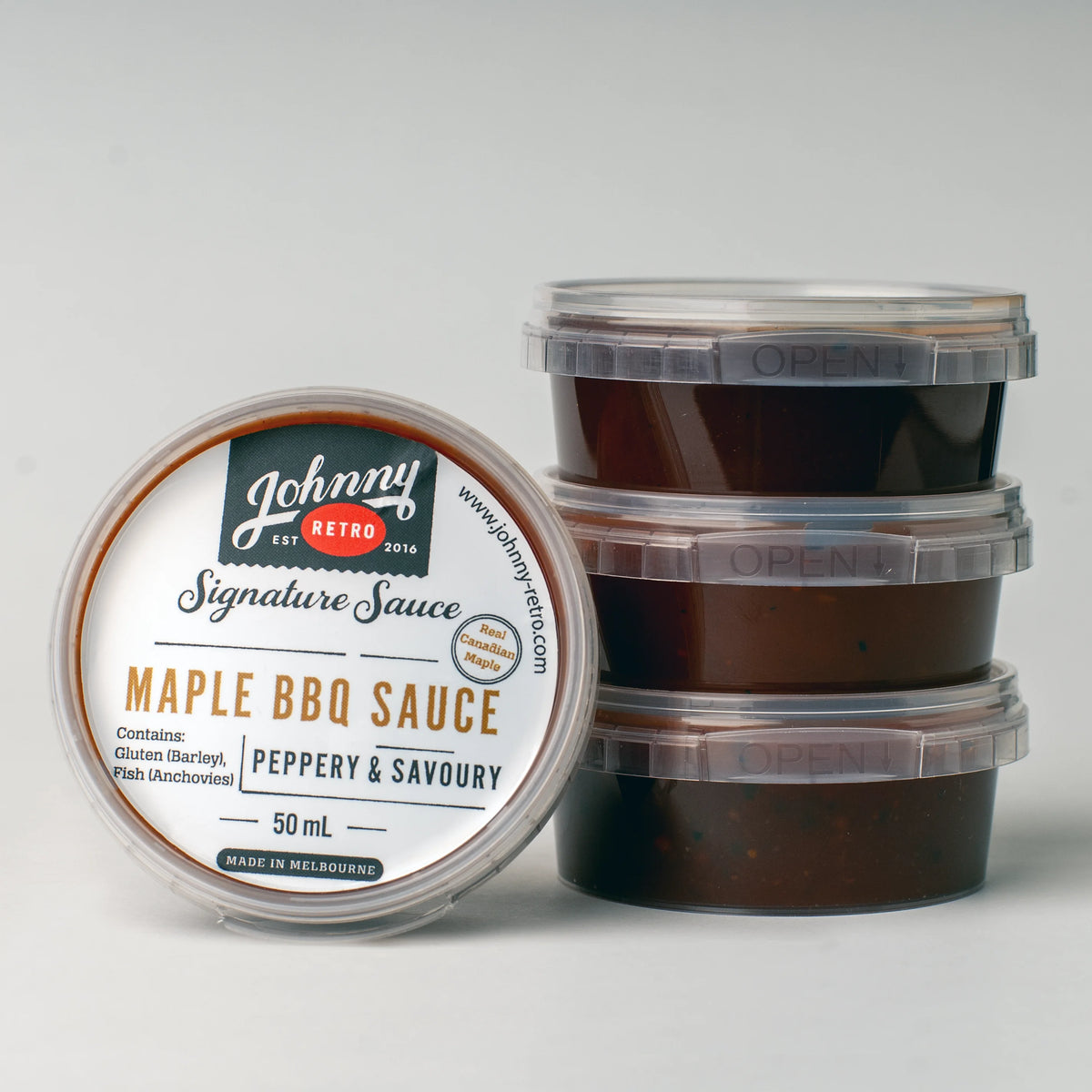 Johnny Retro Maple BBQ Sauce carton with 48 single-serve 50 mL containers